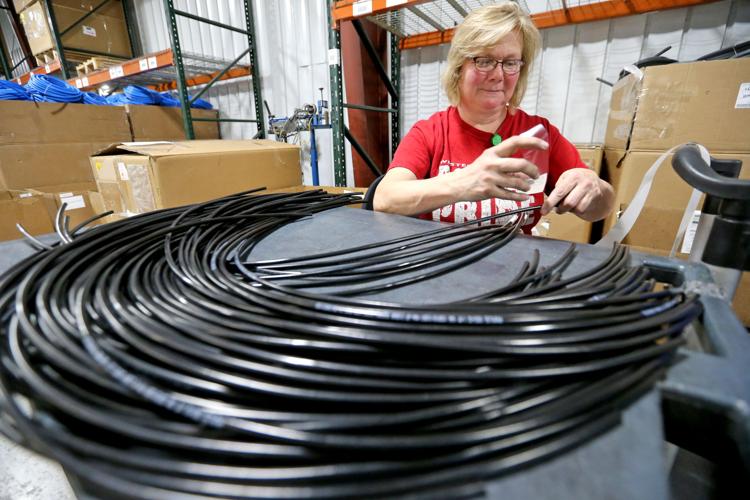 Linda Besler Applying Labels to Hydraulic Hoses